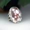3/4 right view, large oval wild horse magnesite gemstone silver statement ring, bezel set with stamped cutout wire accent